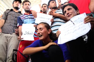 Displaced demonstrators from the minority Yazidi sect demonstrate outside the United Nations offices in Irbil, Iraq, on Aug. 4 in support of those held captive by the self-proclaimed Islamic State.